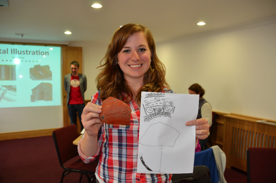 A student from the illustration workshop drawing detailed Samian Ware